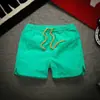 Calças de três partes Shorts de secagem rápida fina de verão masculino Praia Cor sólida Calças de três partes Calças de corrida de maratona da moda do casal