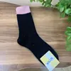 Calcetines de mujer a juego de terciopelo cálido de hilo de punto calcetines apilables estilo japonés de caña media Joker otoño e invierno cálidos INS moda al por mayor calcetines de algodón