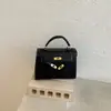 Bolso de mano de color liso transfronterizo tipo Kelly para mujer 2026 nuevo estilo moderno bolso cuadrado pequeño bolso versátil de un solo hombro cruzado comercio exterior