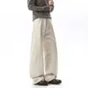 Calça de trabalho estilo americano desconstruída em patchwork de algodão puro lavada para homens, design moderno de outono, calça casual solta de perna curva