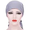 AliExpress nuevo gorro de punto de color liso con dos pompones de arco europeo y americano en stock