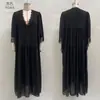 Site independente 2026 Roupas femininas transfronteiriças europeias e americanas retalhos de renda decote V vestido longo manga morcego vestido de férias para praia