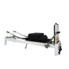 Cama blanca pequeña de aleación de aluminio para Pilates con rieles deslizantes silenciosos, Cama de núcleo de Pilates con marco de aluminio engrosado
