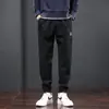 Pantalones casuales de primavera y otoño marca de moda para hombre sueltos atados al tobillo Pantalones deportivos para hombre ropa americana resistente al desgaste de talla grande overol con costuras