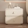 Mesita de noche pequeña moderna y minimalista para uso doméstico, hecha de madera maciza, de color crema, de alta gama, cuero de lujo ligero, con características de almacenamiento e instalación