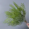 Plantas verdes artificiales en stock, manojos de helecho, hojas de helecho, hierba de helecho para decoración de paredes interiores y diseño de paisajes, césped artificial al por mayor