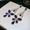 Nuevos pendientes de plata con aguja europea y americana con diamantes, diseño de mariposa y gota de agua, sensación de lujo ligero y alta gama, pendientes exquisitos y de moda para fiestas para mujeres