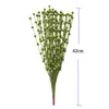 Decoración navideña bola dorada racimos de pistacho racimos de bayas doradas esquejes dorados tenedorcito flor artificial hilo de pez fruta