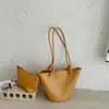 Bolso cubo de moda con patrón tejido de nicho para mujer, nuevo modelo 2026, bolso de hombro para ir al trabajo, bolso cubo de alta gama de gran capacidad