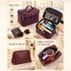 Set de tres piezas de bolsa de maquillaje con patrón de cocodrilo transfronterizo, impermeable, lujo ligero, gran capacidad, alta gama, bolsa de tocador de viaje conveniente