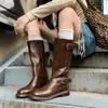 Botas de media caña estilo europeo para mujer, nueva colección de otoño 2026, con hebillas de cinturón, tacones bajos y un estilo nómada inspirado en el Oeste, perfectas para un look de caballero.