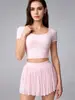 Conjunto Esportivo de Treinamento Pilates Fitness com Saia Curta de Cintura Alta e Camiseta de Manga Curta com Costas em Tela Bonita para Mulheres Versátil