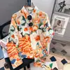 Uma camisa estampada floral retro nova de 2026 para mulheres, com toque vintage, top de performance para primavera e outono, toque de alta costura francesa