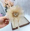 Estilo Novo Primavera e Verão, Versátil e Elegante, Presilha de Cabelo com Franjas, Laço de Flor, Flores de Renda e Design de Garra