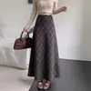 Falda de lana a cuadros retro para mujer, nuevo estilo de otoño, que cubre la cadera, adelgazante, casual, falda larga acampanada con estampado de cuadros