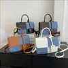 Bolso de mano texturizado de moda patchwork de este año 2025 verano para la oficina elegante bandolera pequeña cuadrada