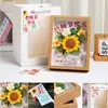 Regalo para el Día del Maestro: Ramo de girasoles tejido a mano con adorno de portafotos, un regalo práctico para profesores