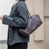 Bolso de piel de vaca de capa superior, bolso de mano coreano de nicho de cuero genuino, bolso de hombro de gran capacidad para el trabajo con un toque de alta gama para mujer