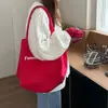 Moda 2025 Nova Bolsa Tote de Ombro com Letras Vermelhas Casual Estudante Nicho Comutador Grande Capacidade Bolsa de Lona