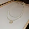 Collar de Perlas con Colgante Plisado Estilo Francés, Lujo Ligero y Sensación de Alta Gama, Cadena para Clavícula para Mujer, Accesorio de Cuello de Moda y Elegante con Diseño Único