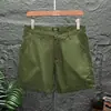 Pantalones cortos casuales para hombre, pantalones de tres cuartos y cuatro cuartos de color liso ajustados a la moda, pantalones ultra cortos elásticos de marca de moda de verano