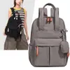 Bolso de mano casual para viajar, bolsa multifuncional para el día a día, mochila de color liso estilo outdoor, mochila de viaje ligera e impermeable