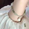 Nueva pulsera Hetian Yu de imitación de nudo de bambú de estilo chino con diseño de nicho, nueva pulsera de cuentas de mano con nudo de bambú de orquídea de estilo chino