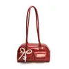 La popular bolsa de axila de este año para mujer, bolso de mano con lazo de cuentas nuevo de invierno 2024, bolso de hombro vintage para el trabajo