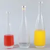 Venta al por mayor del fabricante 330 ml 500 ml Agua Mineral Evian Botella de Agua Mineral de Vidrio para Granjero Lata Imprimir Logo Sello y a Prueba de Fugas