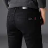 Jeans negros de alta gama para hombre en otoño e invierno, corte slim, pierna recta, business casual, elásticos, modernos, versátiles y forrados de polar