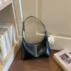 Bolso de mano para mujer Shuai Mi Jia 2026 nuevo de principios de otoño, bolso vintage para hombro o axila, bolso cruzado de alto valor para el día a día