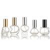Venta al por mayor botella de vidrio para perfume de 10 ml transparente portátil embalaje botella de viaje para perfume divertida botella de spray alienígena