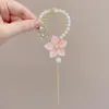 Pinza para el pelo de borla de alta gama para mujer, Perla, Elegante, Versátil, Estilo chino nuevo, Lujo ligero, Pinza para coleta de lirio del valle, Pequeños productos básicos de Yiwu