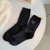 Calcetines Zhuji para mujer otoño e invierno calcetines de media caña color sólido gruesos cálidos felpa de visón sintético bordado Corea del Sur calcetines de piso para mujer al por mayor
