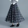 Falda de retazos a cuadros reversible para mujer, nueva falda de cintura alta con corte en A adelgazante para otoño/invierno 2026, falda elegante y versátil