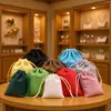 Bolsa de franela con cordón para guardar joyas, estuche para auriculares móviles, suministro directo de fábrica.