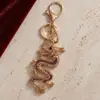 Llavero Creativo de Dragón Chino Signo del Zodiaco Aleación de Zinc Pedrería Llavero de Coche Colgante de Bolso Regalo Venta al por Mayor