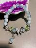 Nueva pulsera de grietas de hielo pulsera de cuerda elástica con cuentas de mariposa dulce niña cuentas de vidrio joyería al por mayor tienda de 2 yuanes