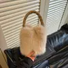 Colección nueva de otoño e invierno transfronteriza: Bolso de mano de color liso, elegante y esponjoso para mujer, que irradia una sensación lujosa y afelpada