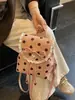 Mochila de encaje con lunares de nuevo estilo 2026 transfronteriza con cordón de lazo, mochila de nicho suave para el día a día