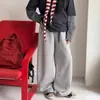 Calça de Moletom Feminina Primavera e Outono 2026 Nova Casual Slim Malha Calça de Moletom Crianças Médias e Grandes Esportiva Calça de Perna Larga Tendência Transfronteiriça
