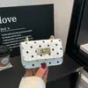Bolso con Hebilla de Cierre para Mujer 2026 Nuevo Estilo Moda Tendencia Lunares Pequeño Bolso de Asa Superior Textura de Alta Calidad Elegante Bolso de Hombro Único Cruzado
