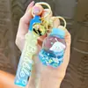 Nuevo llavero de biberón transfronterizo, exquisito colgante de arena líquida, accesorio de llavero para bolso, pequeño regalo, venta al por mayor de comercio exterior