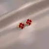 Aretes de trébol de cuatro hojas esmeralda caliente transfronterizos, nuevos aretes de alta gama, chapados en cobre con oro real de 18k, venta al por mayor de fabricantes