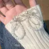 Pendientes de perla con lazo, frescos y elegantes, aretes versátiles de estilo hada para mujer, accesorios de joyería para orejas de estilo nicho japonés coreano, venta al por mayor