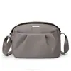 Bolsa Transversal Simples de Nicho Feminina Versátil Leve Nova Moda Primavera e Verão 2025 Bolsa de Ombro Bolsa de Tecido de Nylon Impermeável