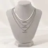 Collar de cadena de cobre simple, personalizado, transfronterizo europeo y americano, con múltiples elementos, de aleación geométrica de moda, joyería en forma de T para mujeres