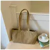 Bolsas de lona casuales de nicho al por mayor para mujer, nuevo bolso tote simple de color liso de gran capacidad, bolso de hombro para el antebrazo para el trabajo