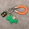 Llavero de Dibujos Animados Lindo "Hazte Rico Pronto" Creativo Llavero para Llaves de Coche Cuerda Trenzada de Cuero Colgante para Mochila Regalo