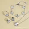 Conjunto de Joias de Aço Inoxidável Banhado a Ouro 18K, Trevo de Quatro Folhas, Colar, Pulseira e Brincos, Venda Quente Transfronteiriça, Atacado Direto da Fábrica